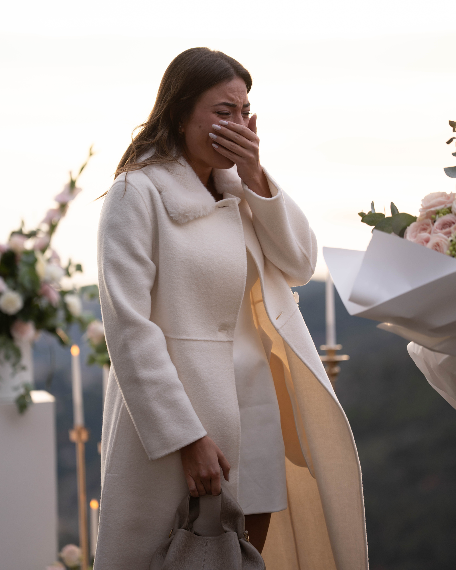 Emotion reaction during a luxury marriage proposal in Èze on the French Riviera, woman overwhelmed with joy in an intimate romantic setting.